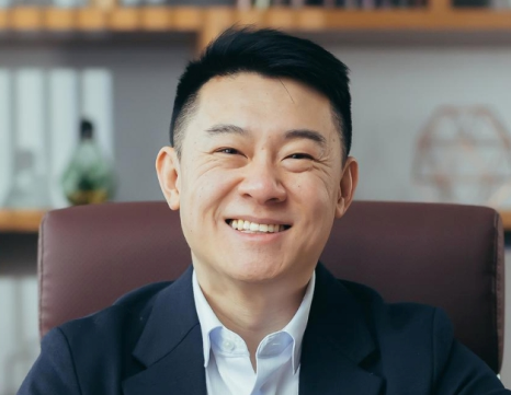 Portrait Successful Asian Banker Businessman Working Office Looking Camera Smiling Counting Metal Coins Table 1